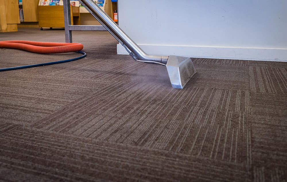 Commercial Carpet Cleaning, removing stains and soils from a carpet.